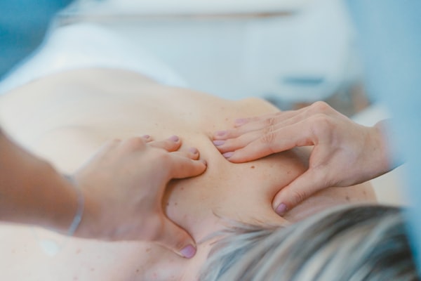 Chiropractor performing spinal adjustment treatment